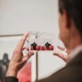 A man looks at a photo inside the Museum of Photographic Arts