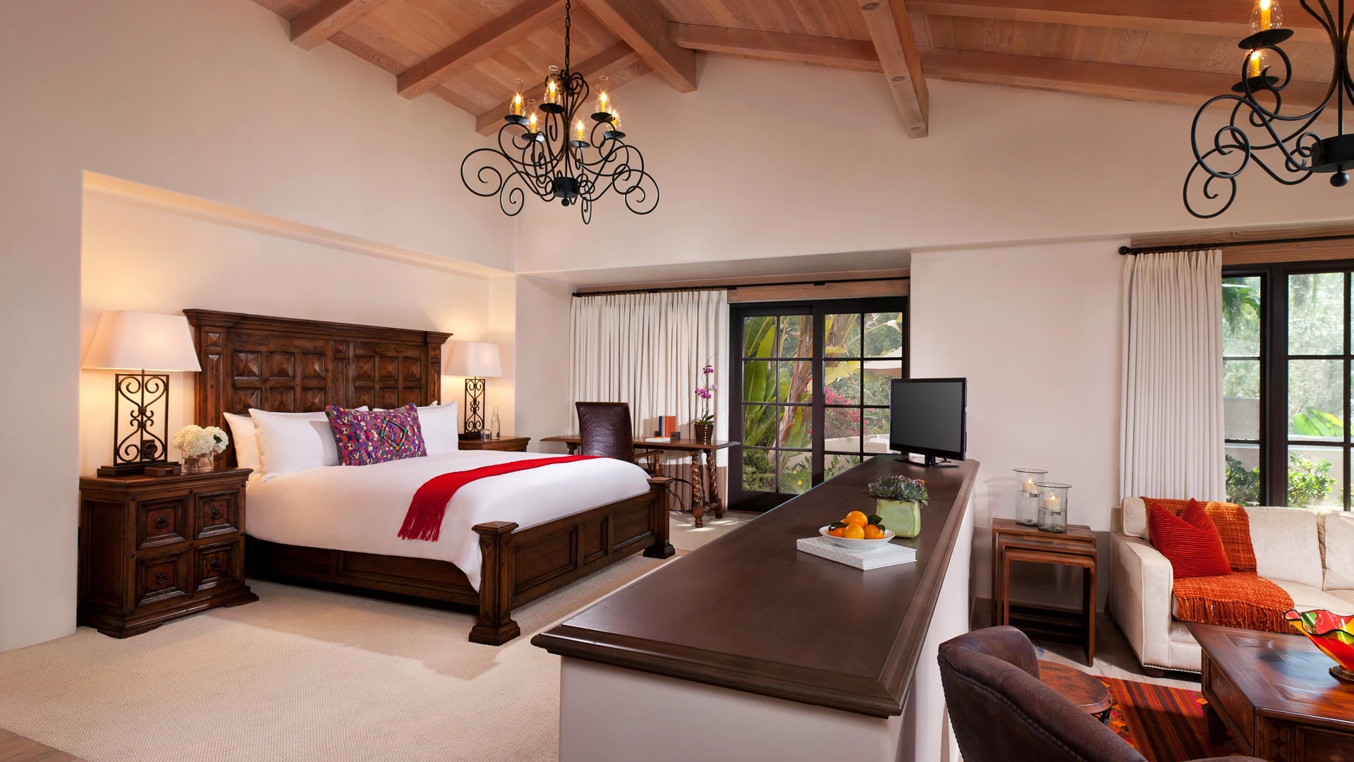 Olive Grove Suite bedroom with vaulted ceiling at Rancho Valencia, a popular San Diego family resort.
