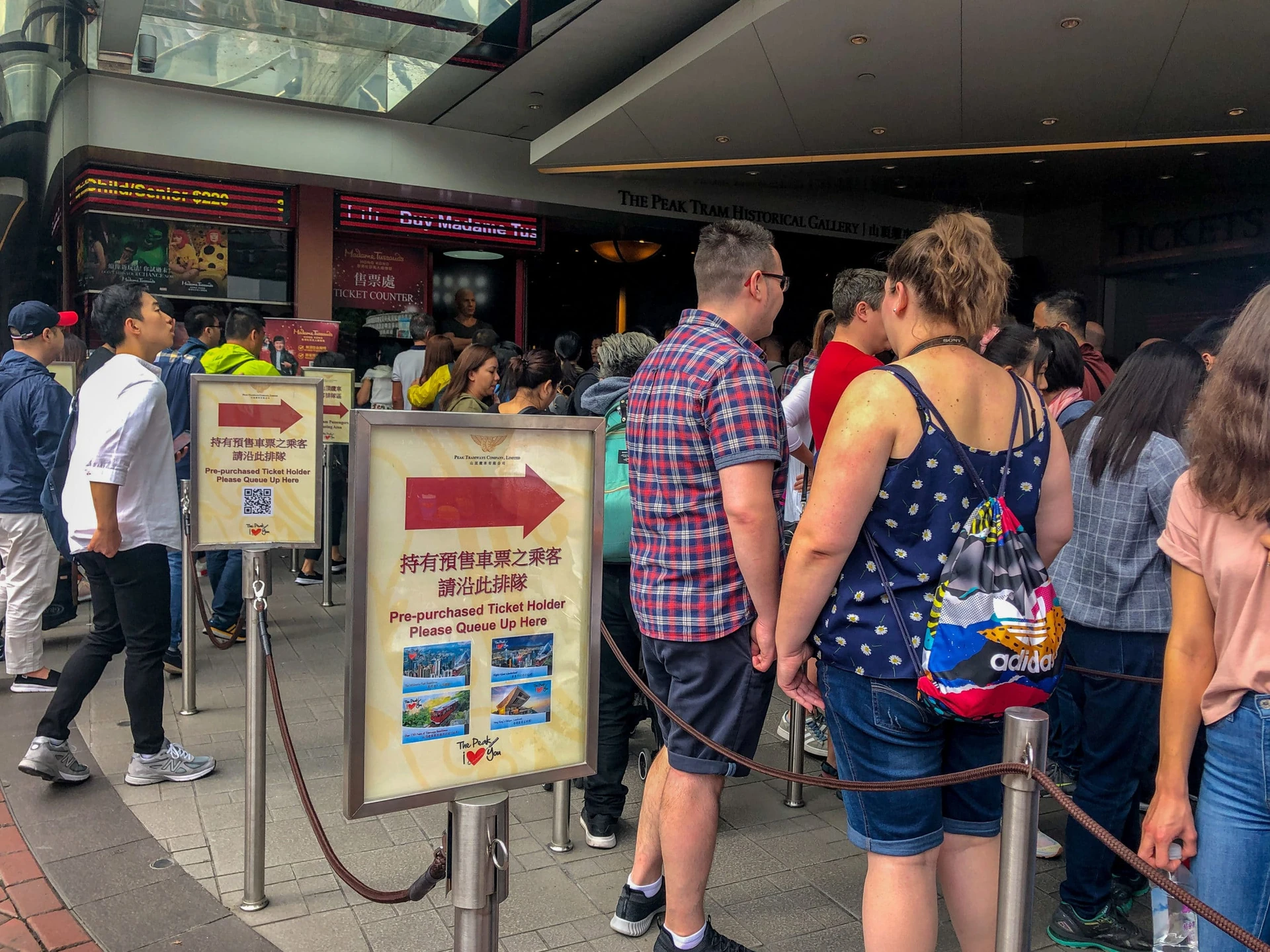 Locals and tourists line up for tickets to ride The Peak Tram in Hong Kong.