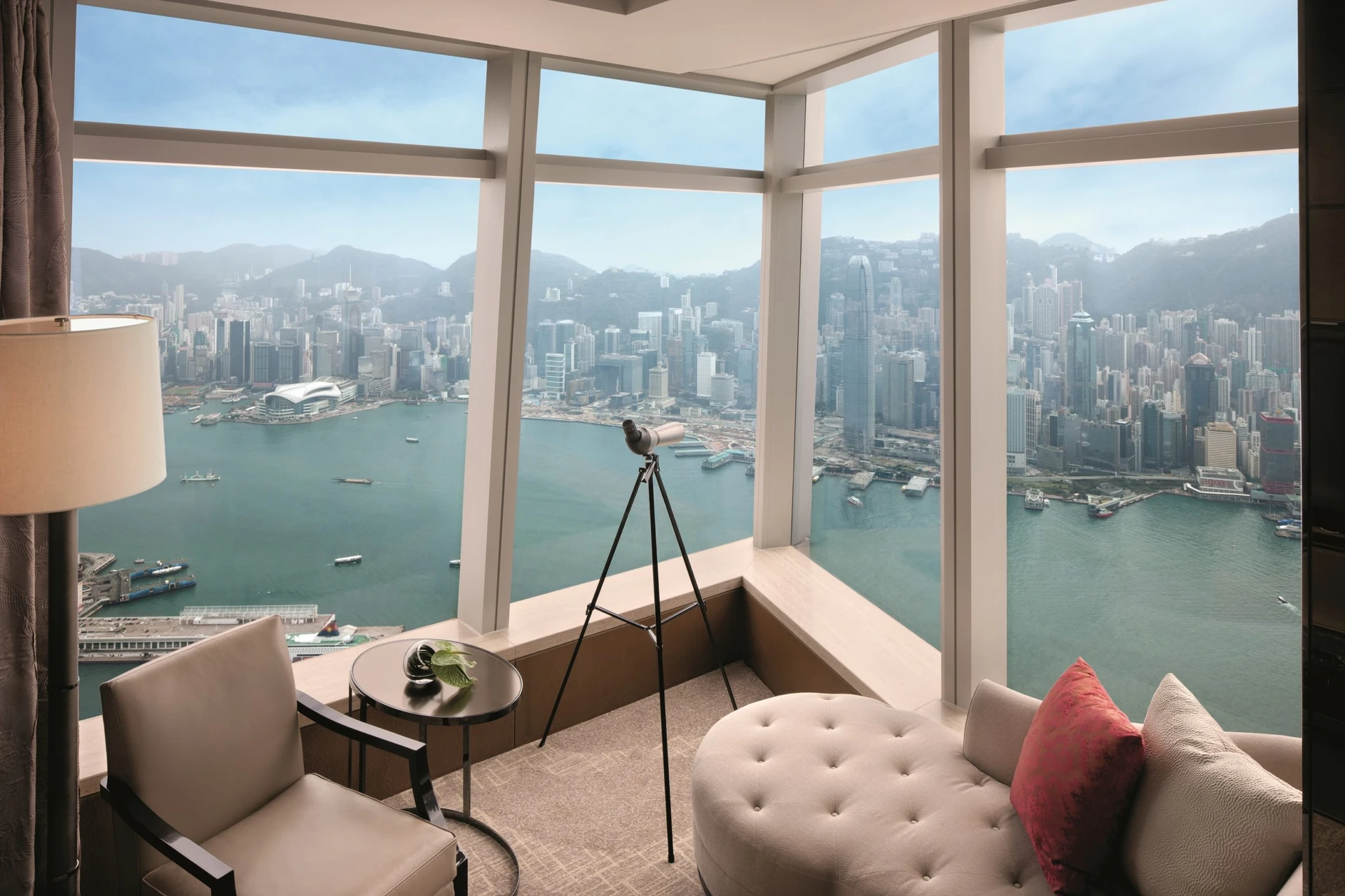 Panoramic harbour view from windows in The Ritz-Carlton Hong Kong club lounge.