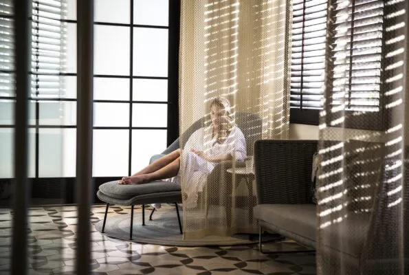 A woman relaxes in lounge area at Driftwood Spa at Four Seasons Residence Club San Diego, Aviara.