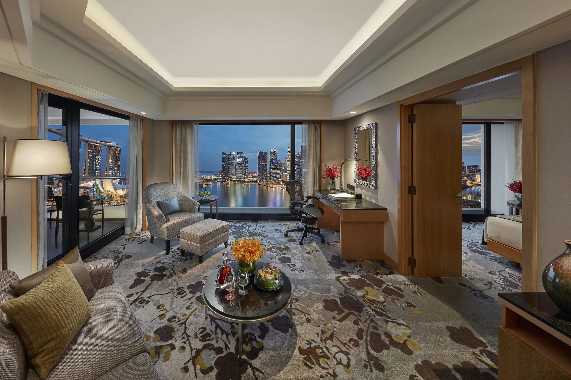 Marina Bay Suite living room with view over the water.