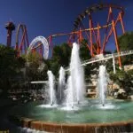 Tips for visiting Six Flags Magic Mountain and its 19 roller coasters including how to buy discount tickets, maximizing line weights, what to eat and more.