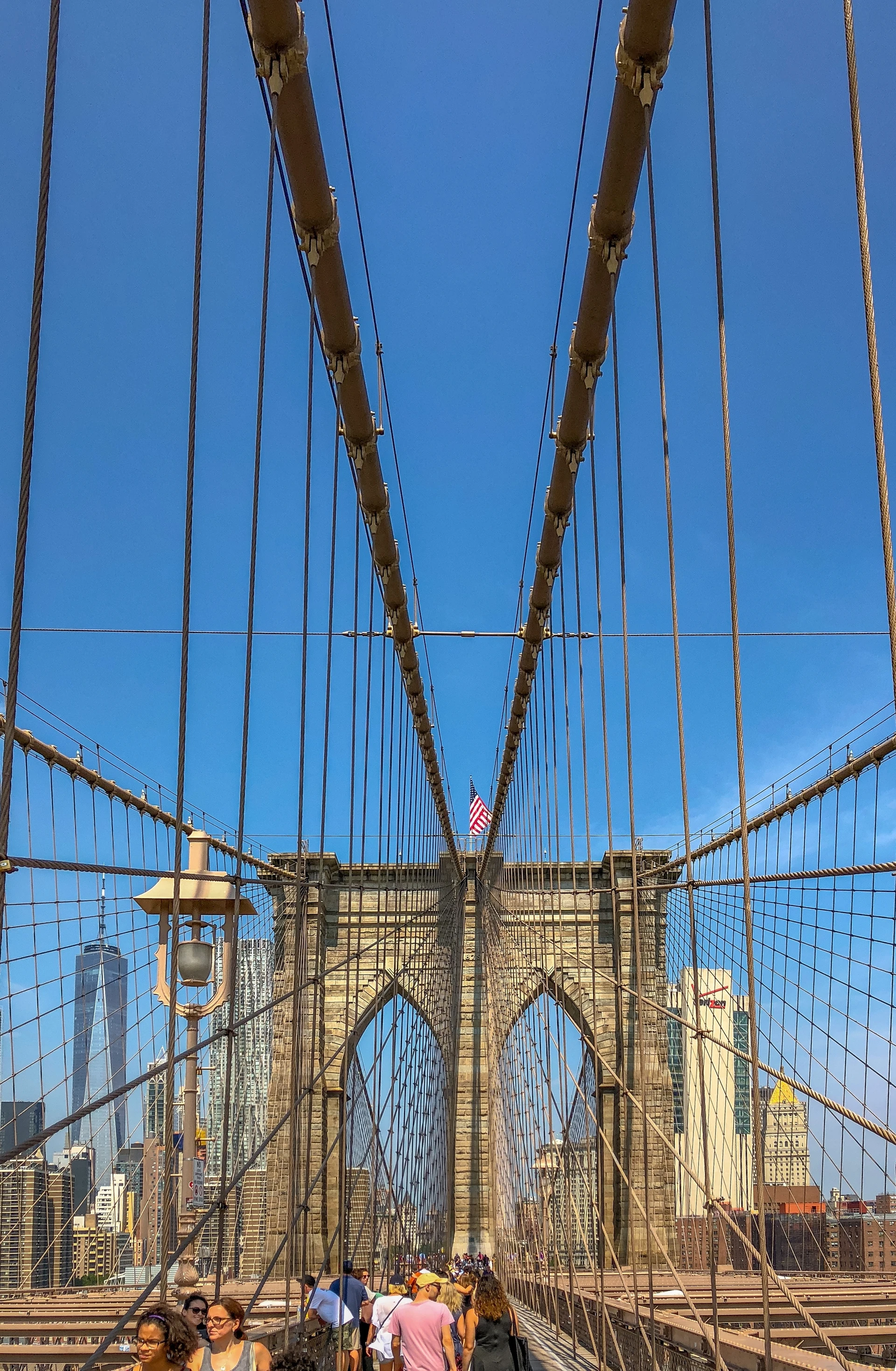 Walk across the Brooklyn Bridge, one of the best things to do in New York City in good weather.