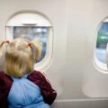 Child looking out of an airplane window