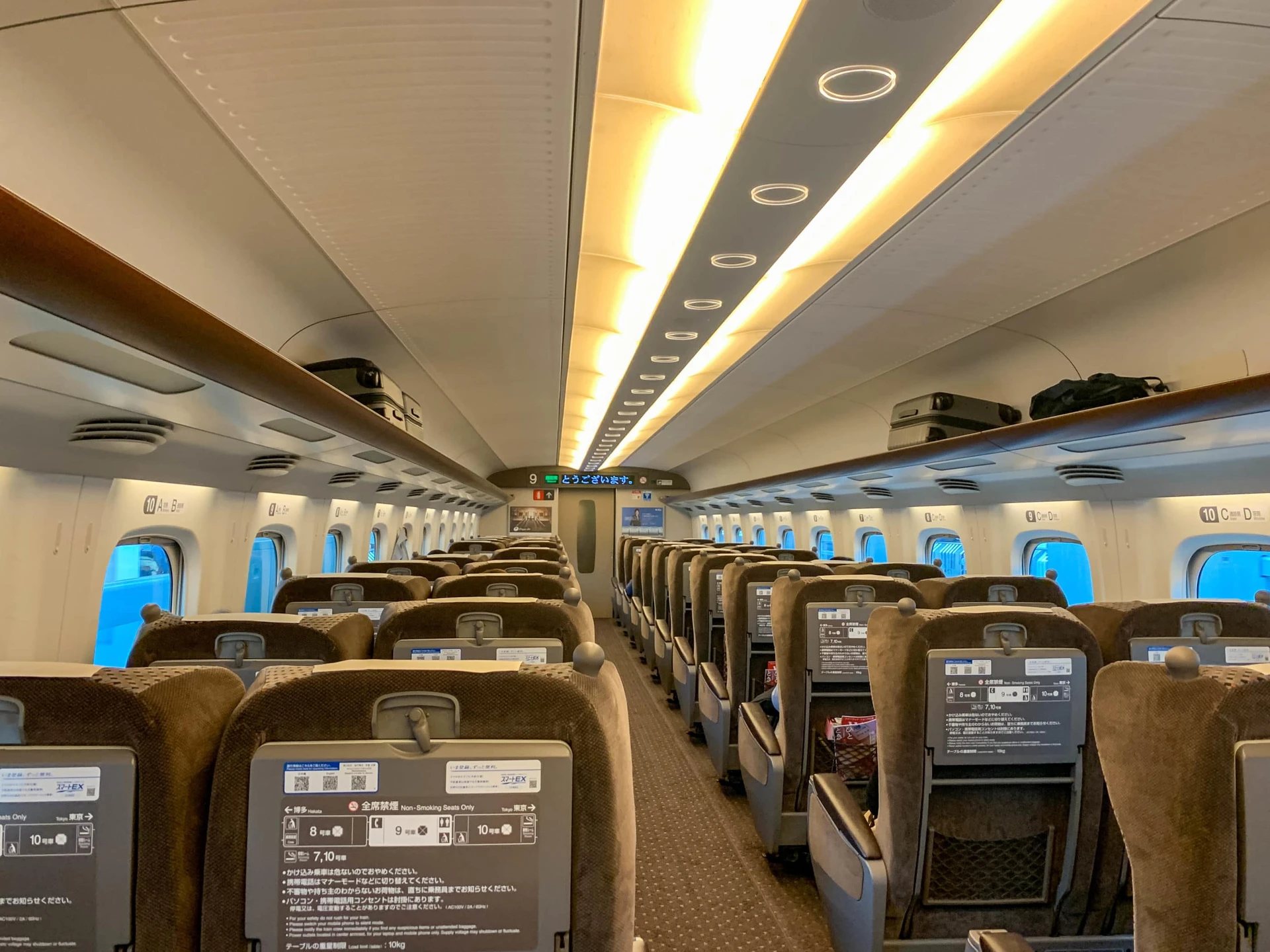 Interior of a green class car on a shinkansen from Kyoto to Osaka.