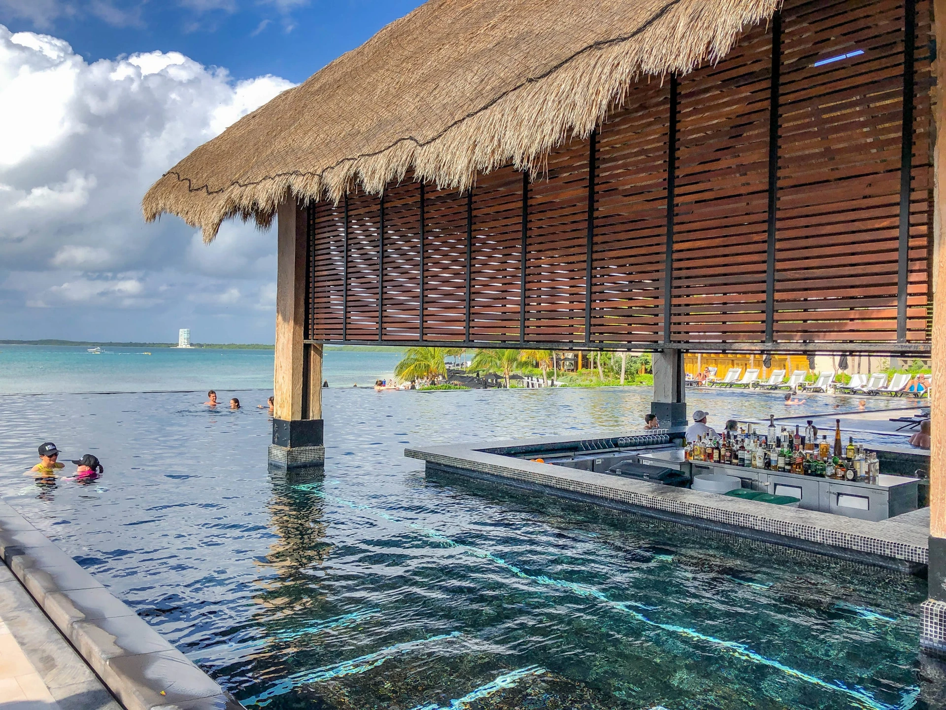 Main pool swim-up bar area at NIZUC Cancun