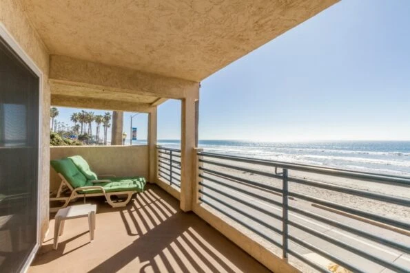 Lounge chair on a deck overlooking the beach