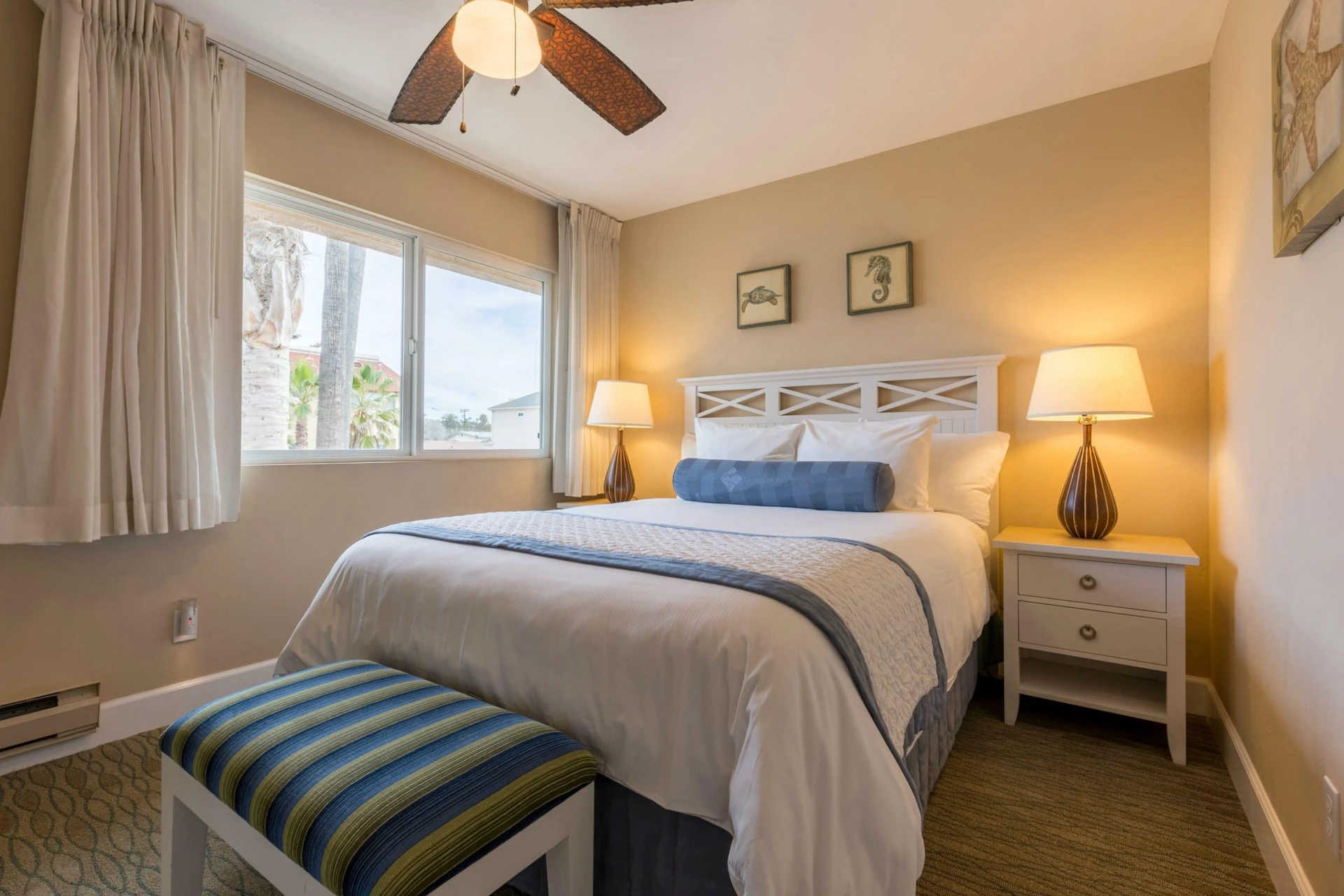 Coastal decor in a bedroom at Southern California Beach Resort