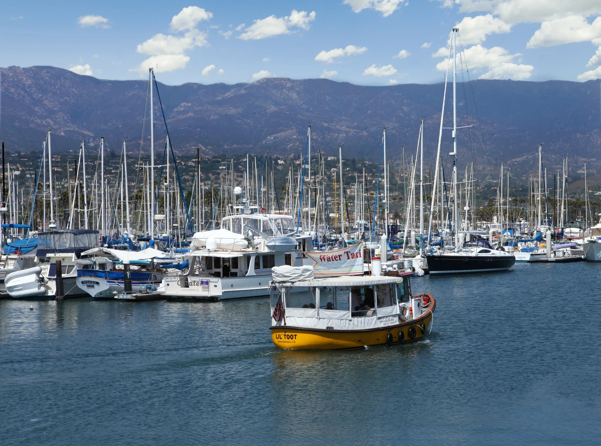 The Lil' Toot Water Taxi sailing in Santa Barbara harbor.