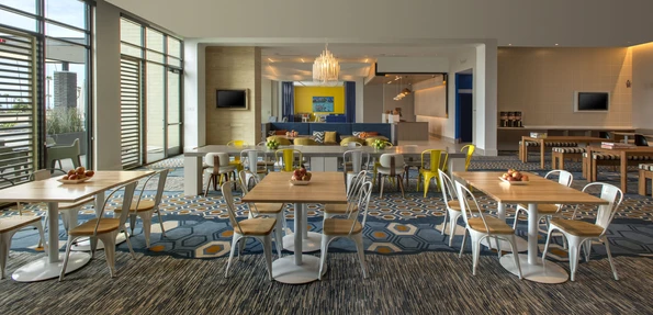 First floor dining room with tables and chairs