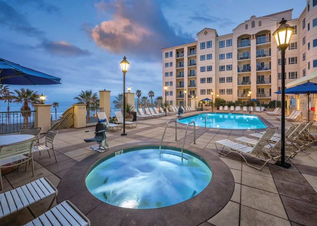 Pool deck with ocean view at Wyndham Oceanside Pier Resort