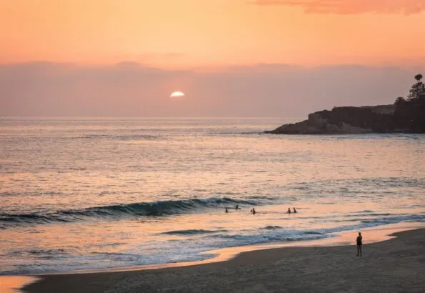 The beach at sunset in front of Waldorf Astoria Monarch Beach Resort.