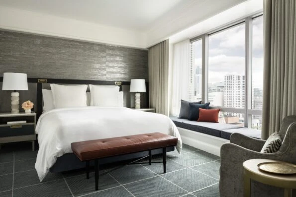 King guest room in white and grey tones at Four Seasons Hotel San Francisco, a top pick for luxury hotels.