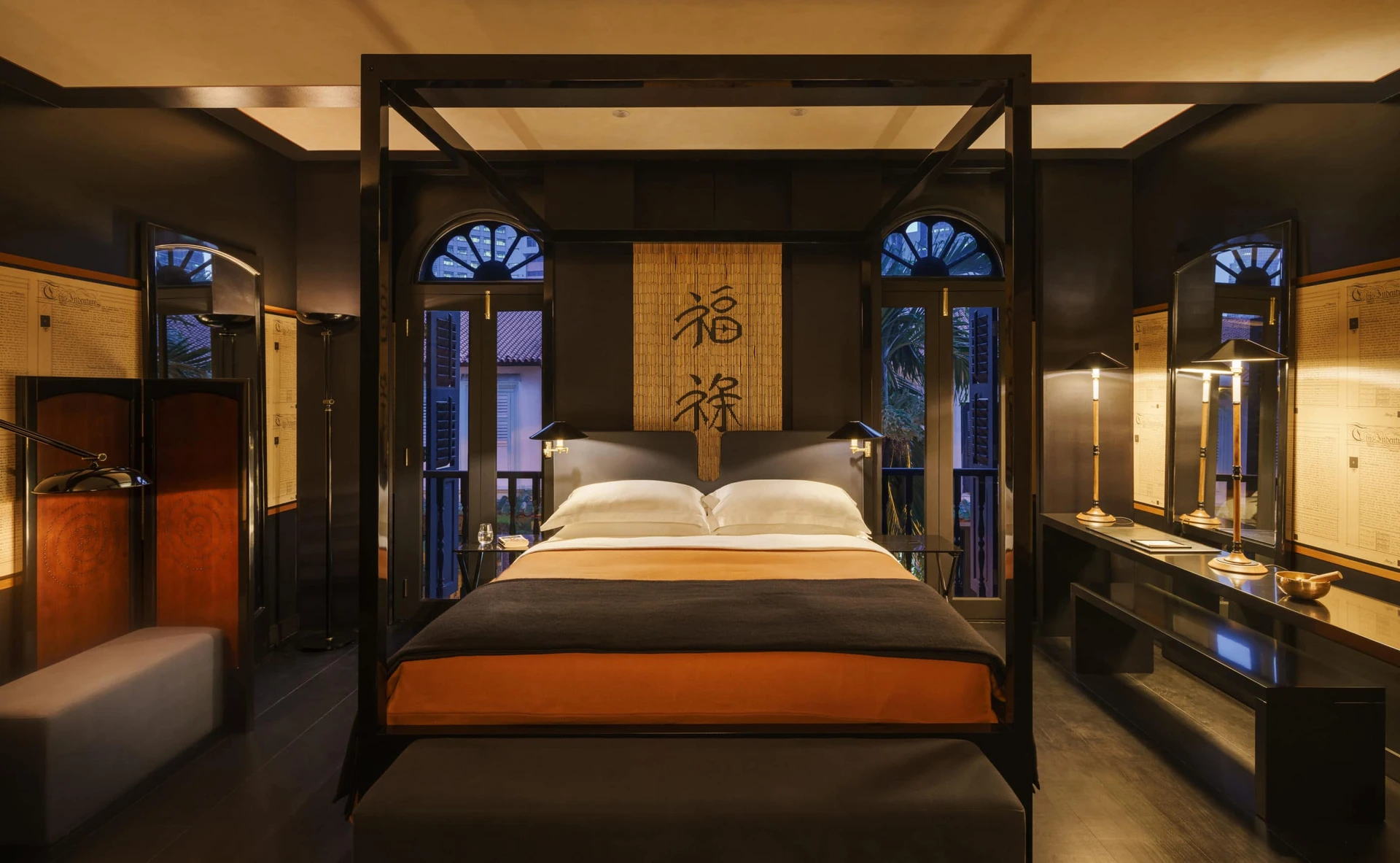 The Opium room features dark wood furnishings and walls with hints of rust-color.