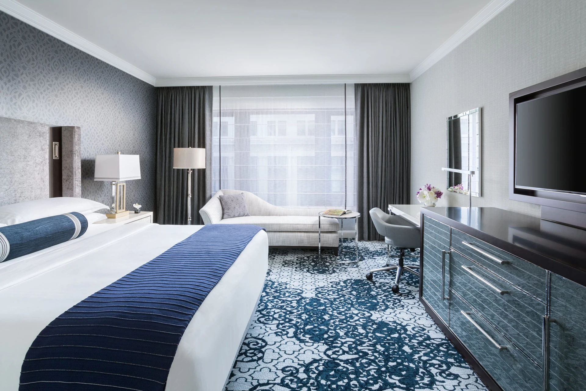 Blue hues inside of a Superior King room at The Ritz-Carlton San Francisco, one of the best luxury hotels.