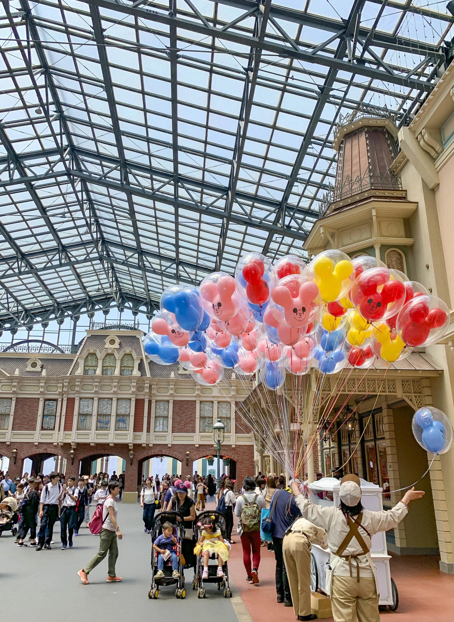 Mickey Mouse balloons for sale at the World Bazaar entrance to Tokyo Disneyland, one of the top things to do in Tokyo with kids.