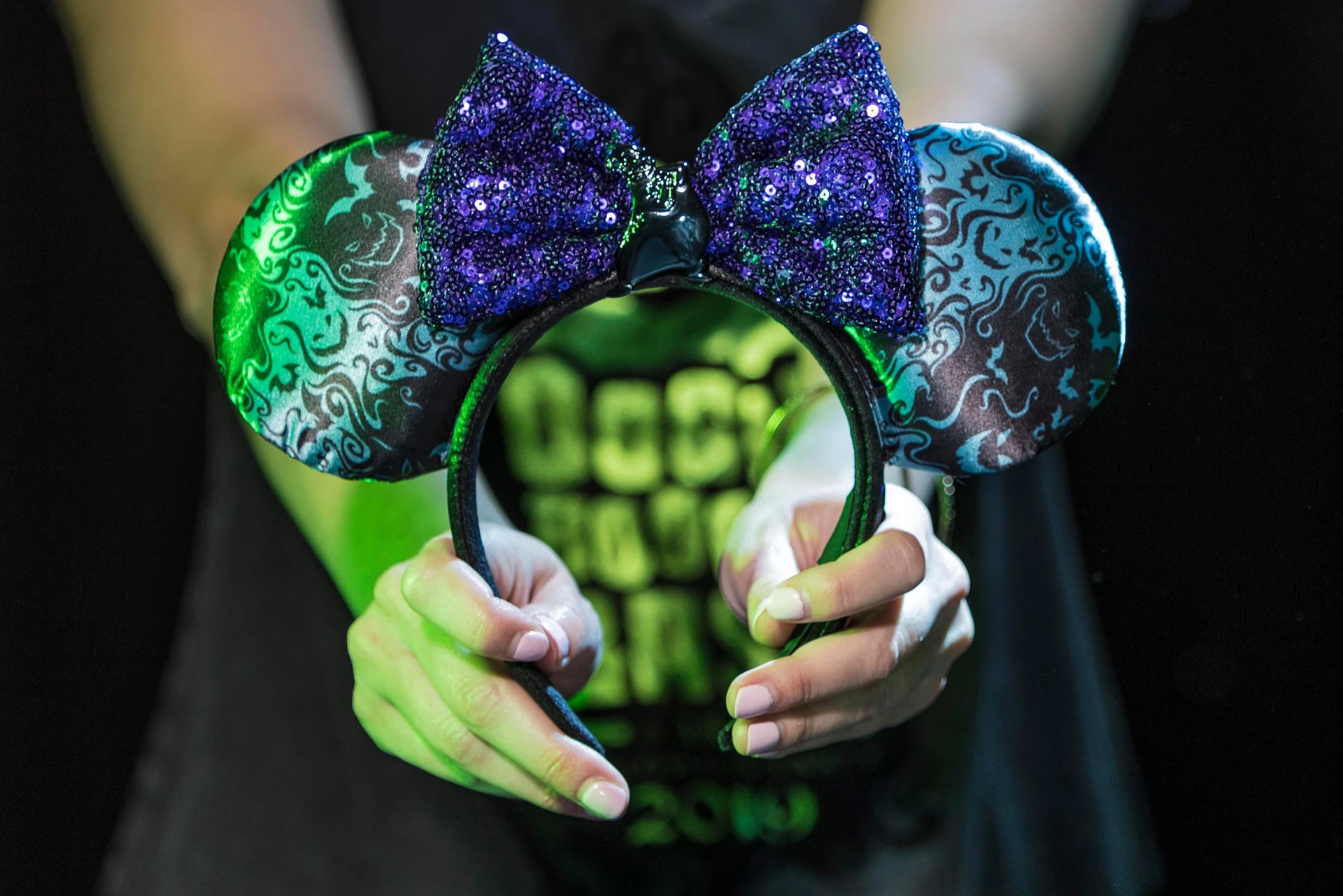 An Oogie Boogie Bash Mickey ears headband with purple sequined bow.