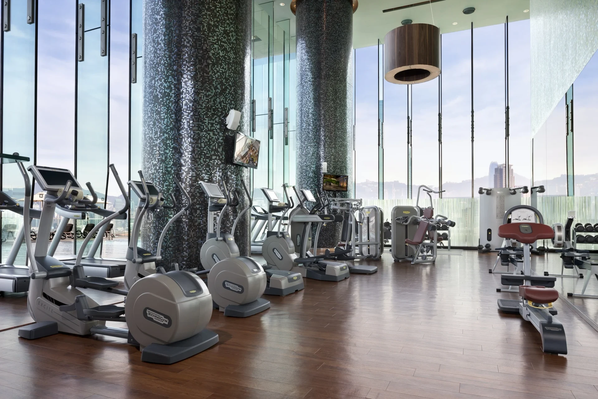 Cardo equipment inside the gym looks over the harbour through floor to ceiling windows.