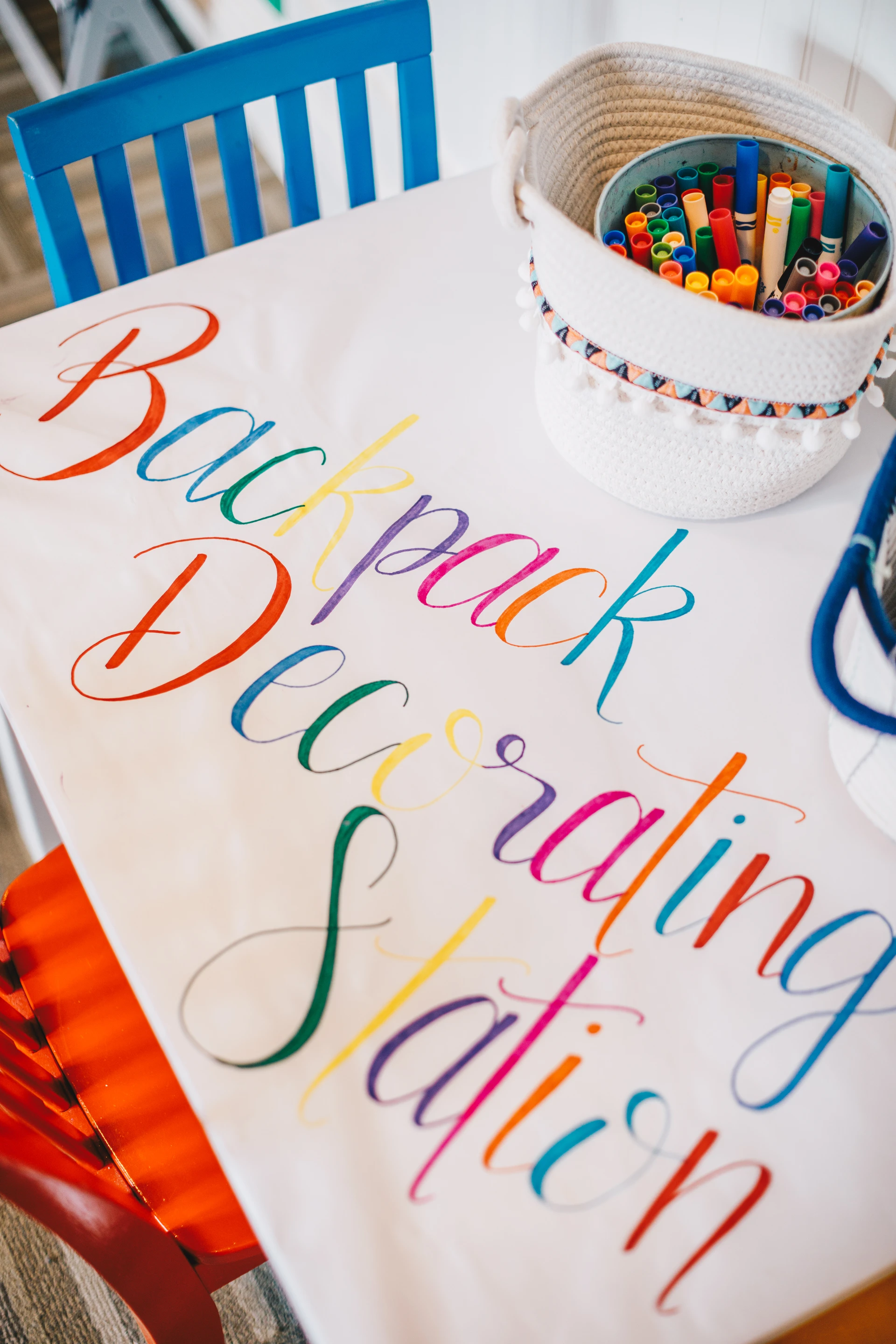 A table covered in paper for kids to color backpacks on at Montage Laguna Beach.