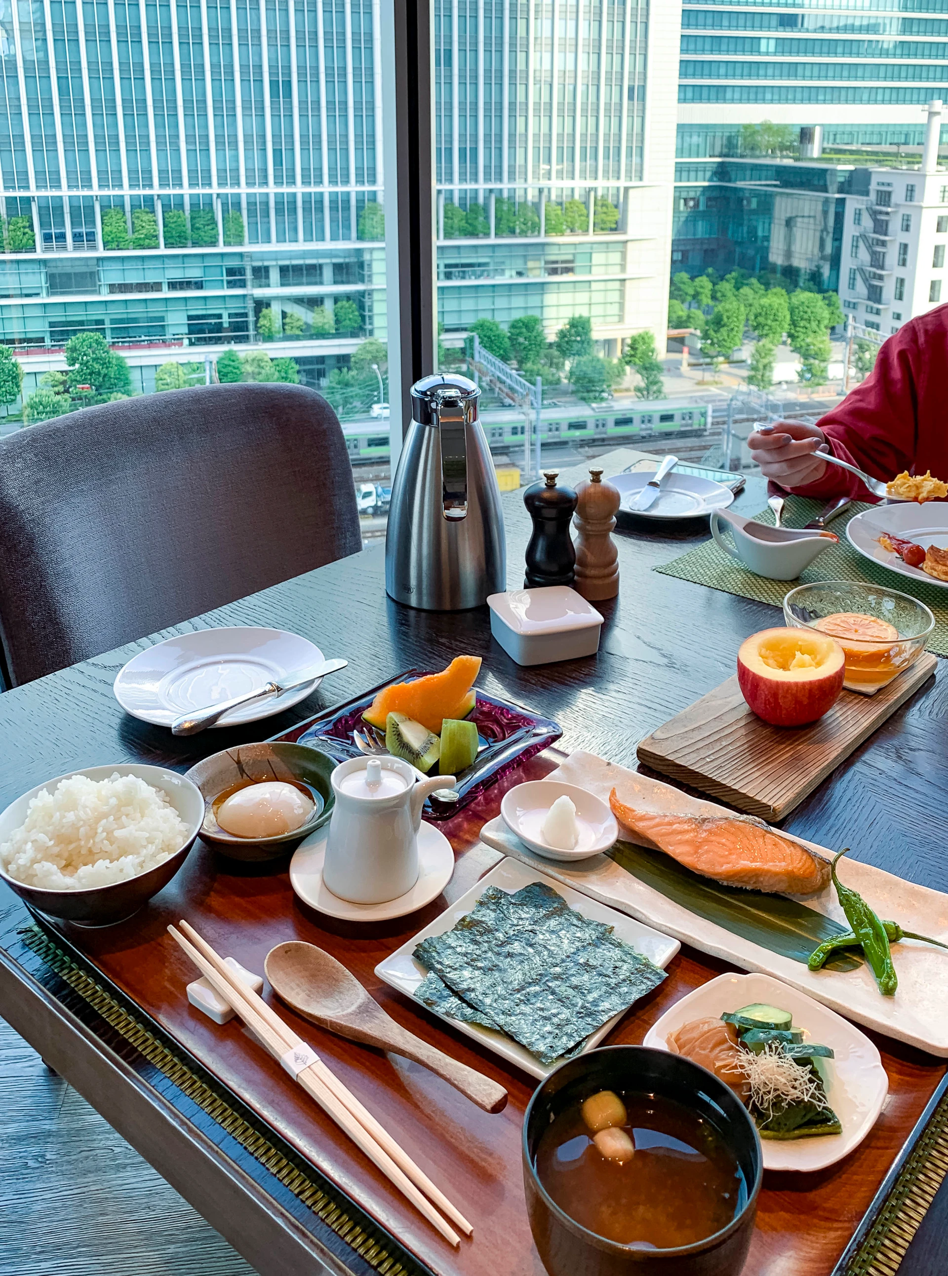Japanese breakfast served with a view at Four Seasons Hotel Tokyo at Marunouchi, our favorite luxury hotel in the city.