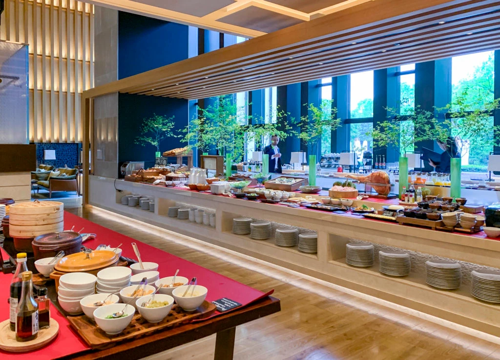 A wide shot of one side of the long buffet counter (there is mort on the other side) at Four Seasons Kyoto.