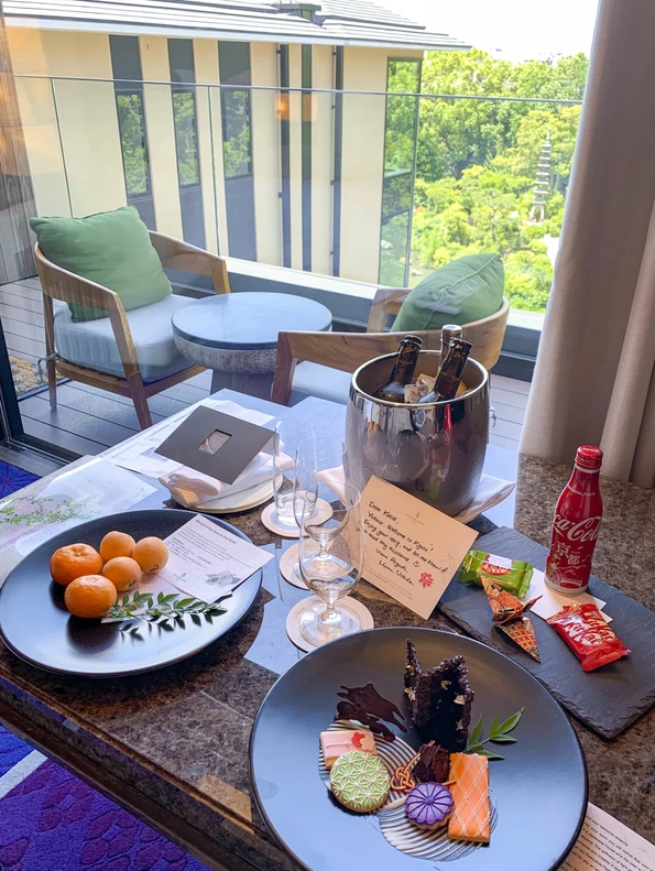 Our welcome amenity of sweets and drinks beautifully plated on a table.