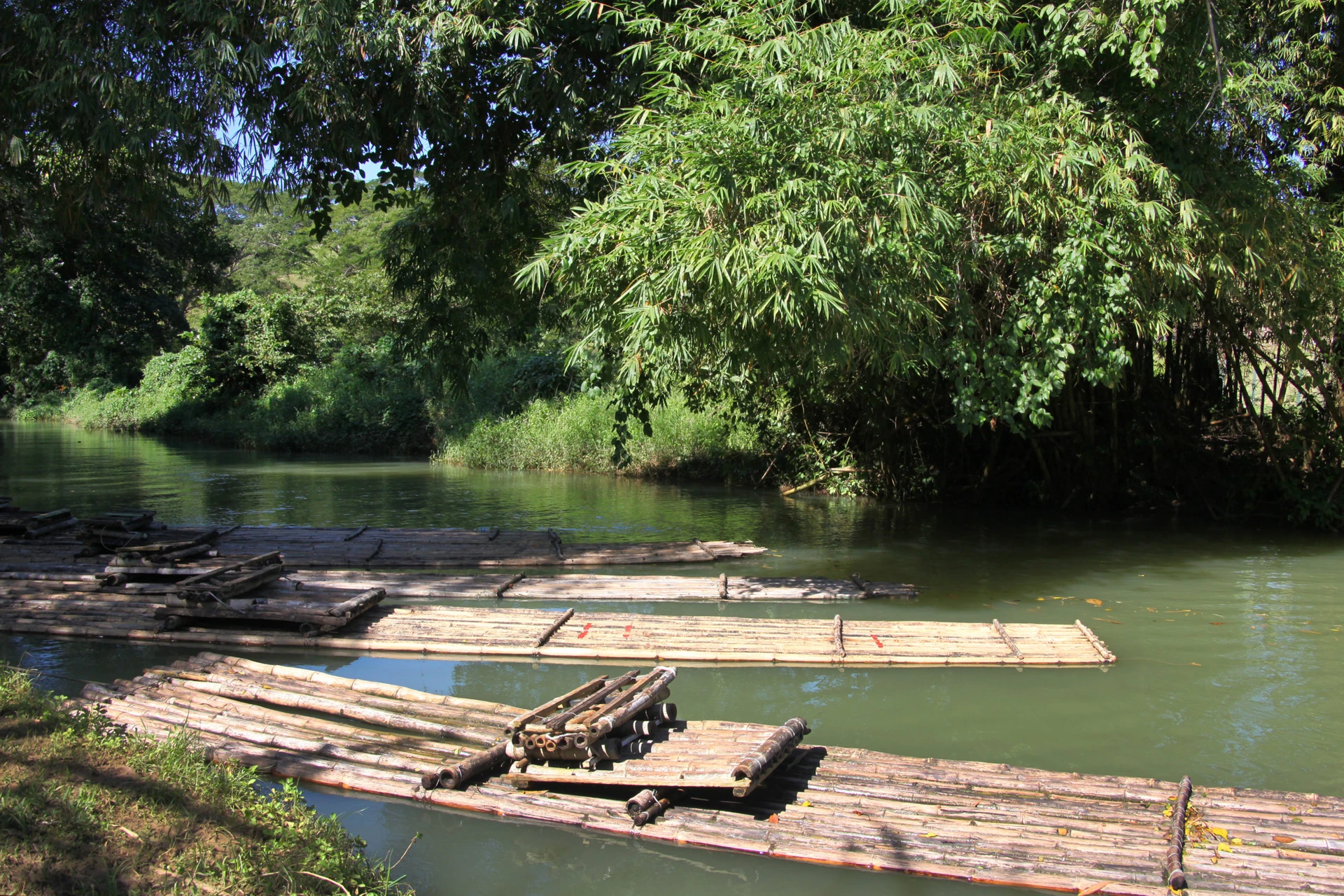 Rafts float on the water in the Martha Brae Village.