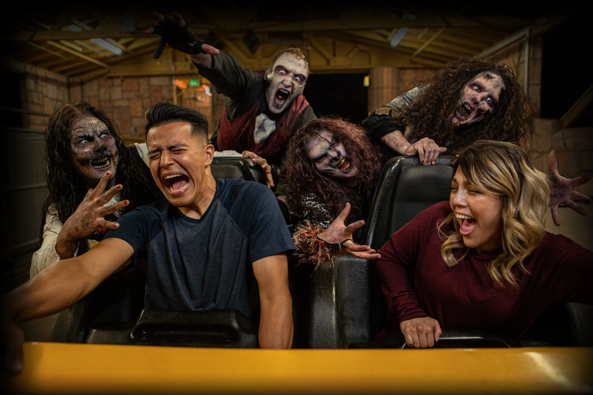 Ghouls scare riders as they board the Goliath roller coaster at Six Flags Magic Mountain.
