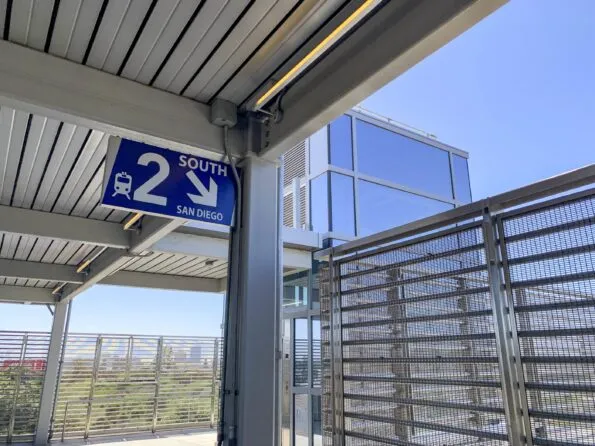 A sign directs passengers to the track for San Diego bound trains.