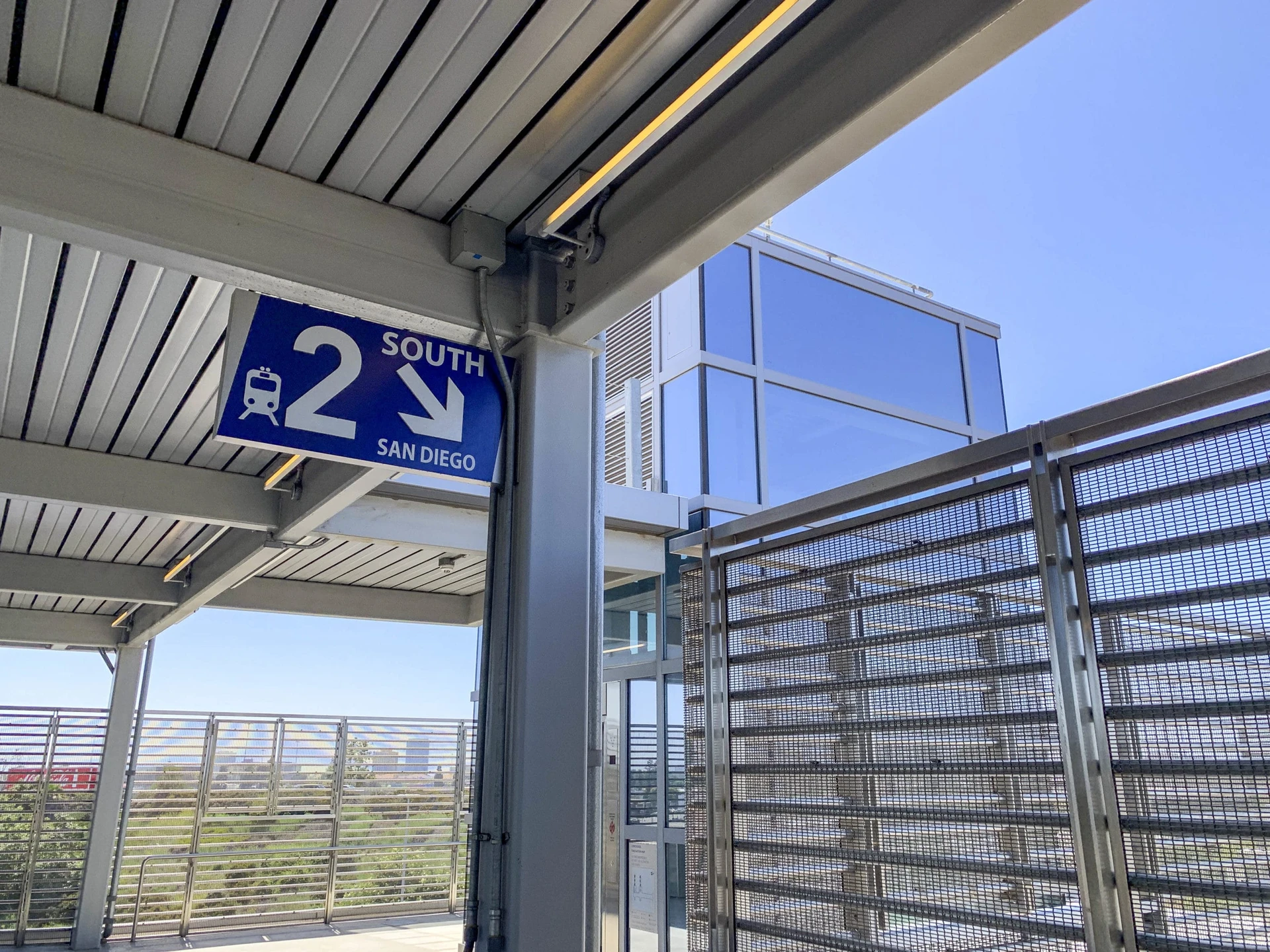 A sign directs passengers to the track for San Diego bound trains.