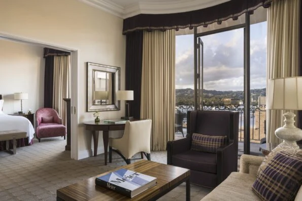 Two-bedroom beverly suite with a view over the living room to a master bedroom