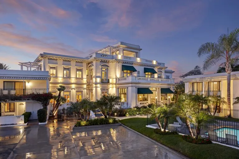 The exterior of Glorietta Bay Inn, a Coronado hotel, at dusk.