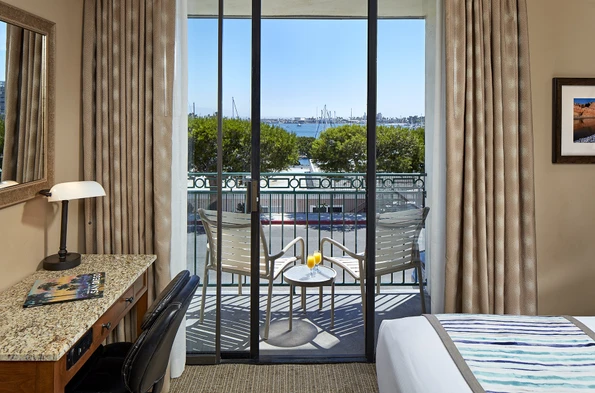 View from a king room over the balcony and out to the bay at Glorietta Bay Inn.