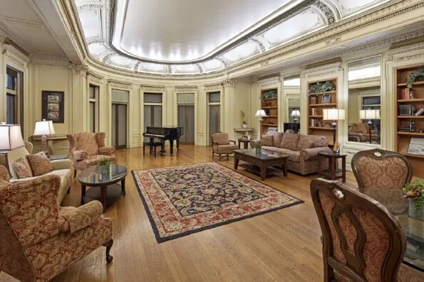 The Music Room lounge area with a grand piano.