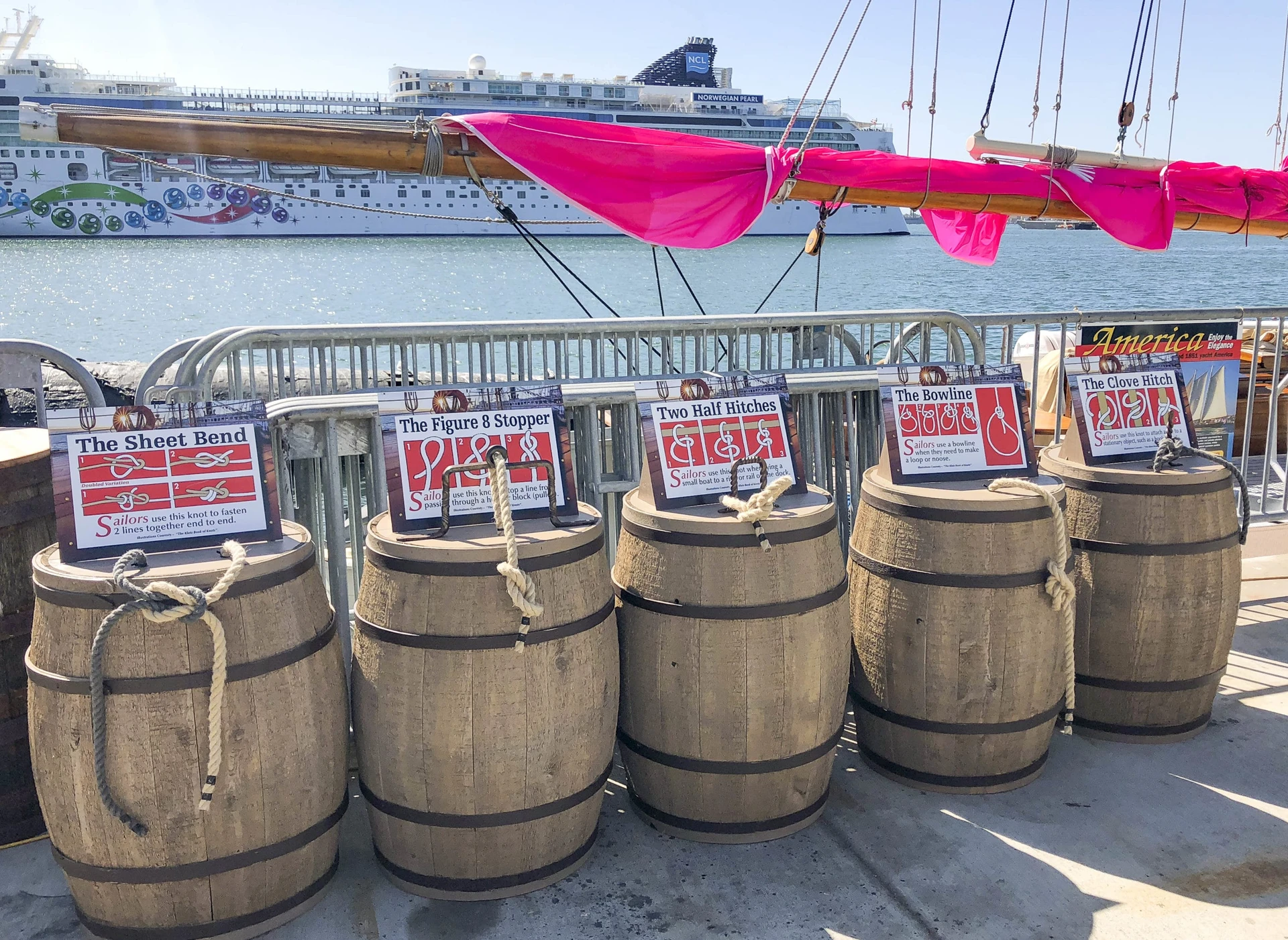 Barrels with signs that have directions for how to tie sailors knots that guests of Maritime Museum of San Diego can try to tie themselves.