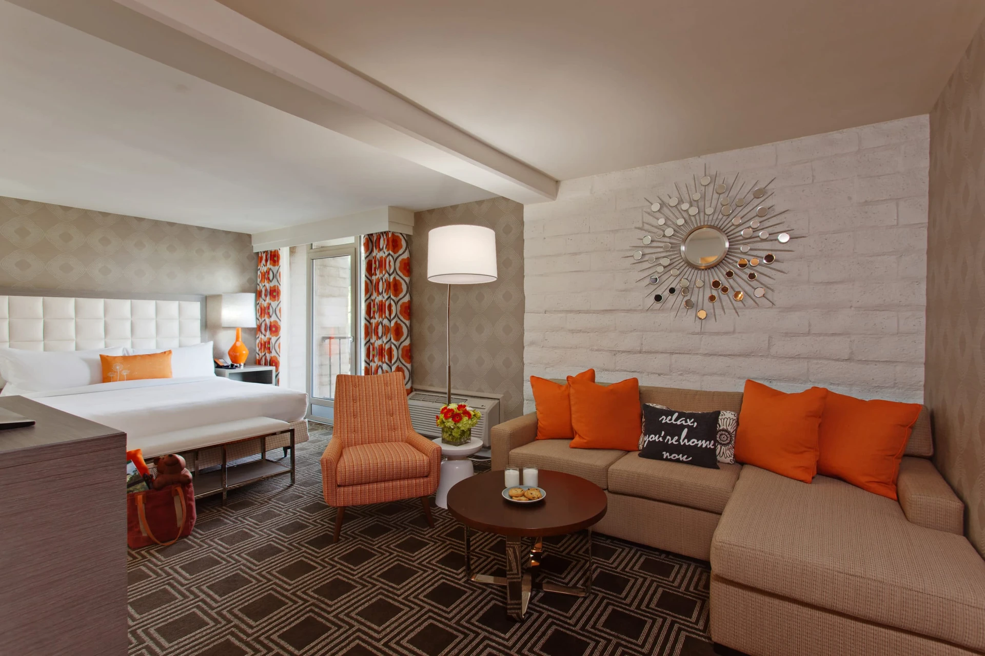 Family suite at The Garland with neutral tones and pops of orange in the typical Hollywood style.