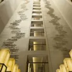 Upper House Hong Kong's interior atrium with multi-story art up the walls