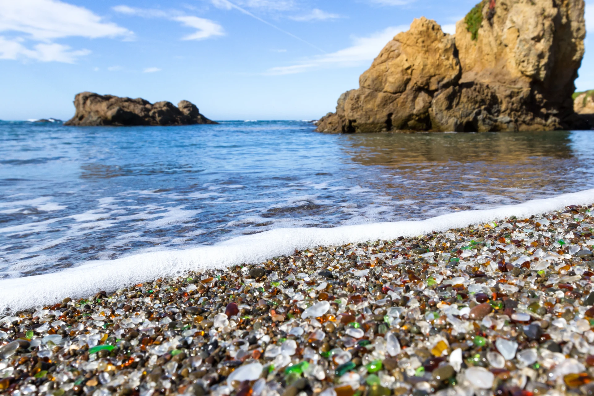 Sea glass mixed in with pebbles at the shoreline of Glass Beach, Fort Bragg California.