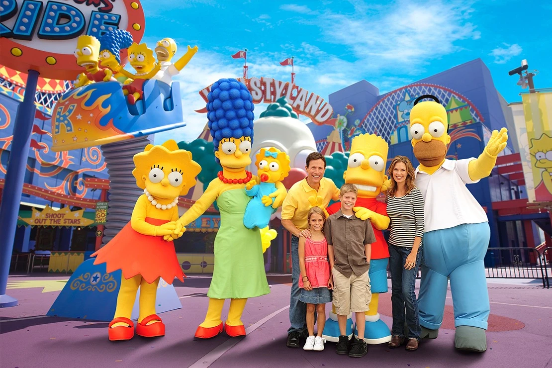 A family poses with costumed Simpsons character.