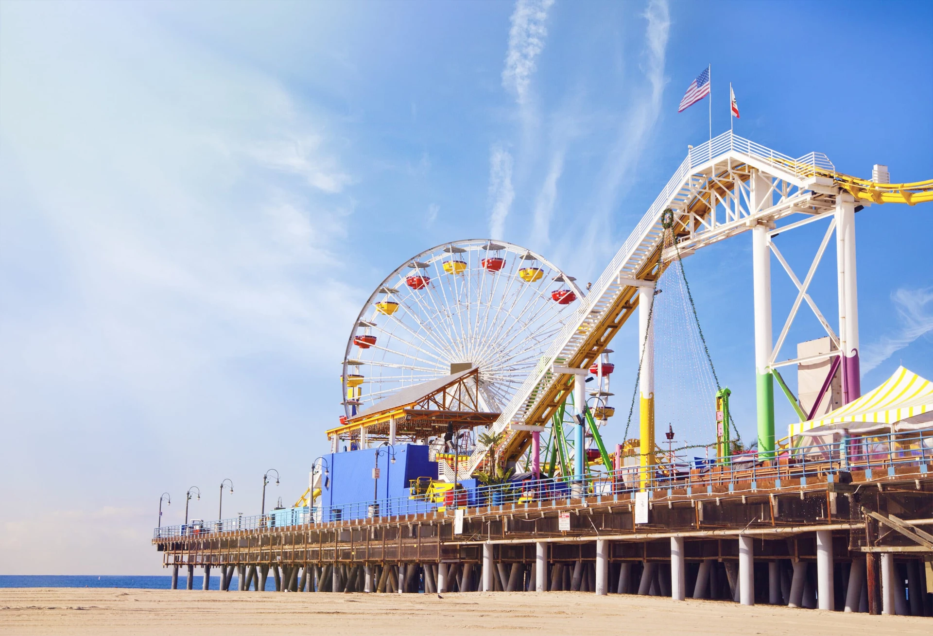 Ferris wheels and coaster on Santa Monica pier.