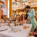 Princess Jasmine meets a guest at Napa Rose restaurant during Disneyland character dining.