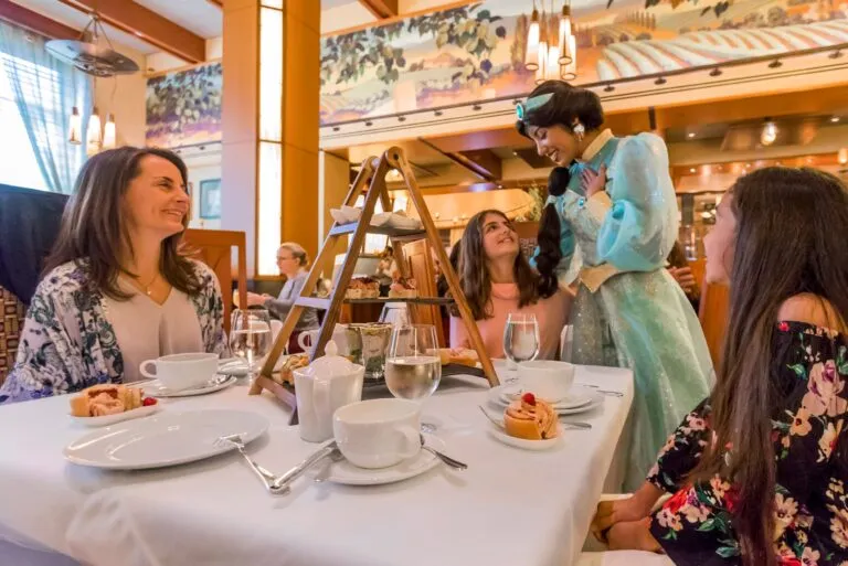 Princess Jasmine meets a guest at Napa Rose restaurant during Disneyland character dining.