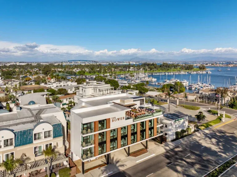 Aerial view of The Bower Coronado hotel to San Diego Bay.