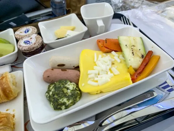 Main course breakfast of eggs, sausage and vegetables on EgyptAir business class from Istanbul to Cairo.