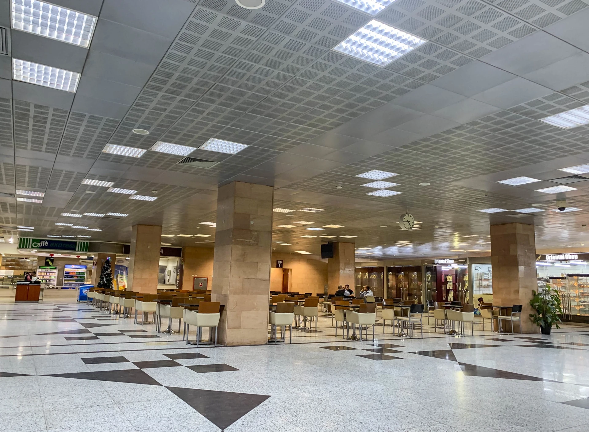 A view of the empty cafe seating area in the departures area of Luxor airport.