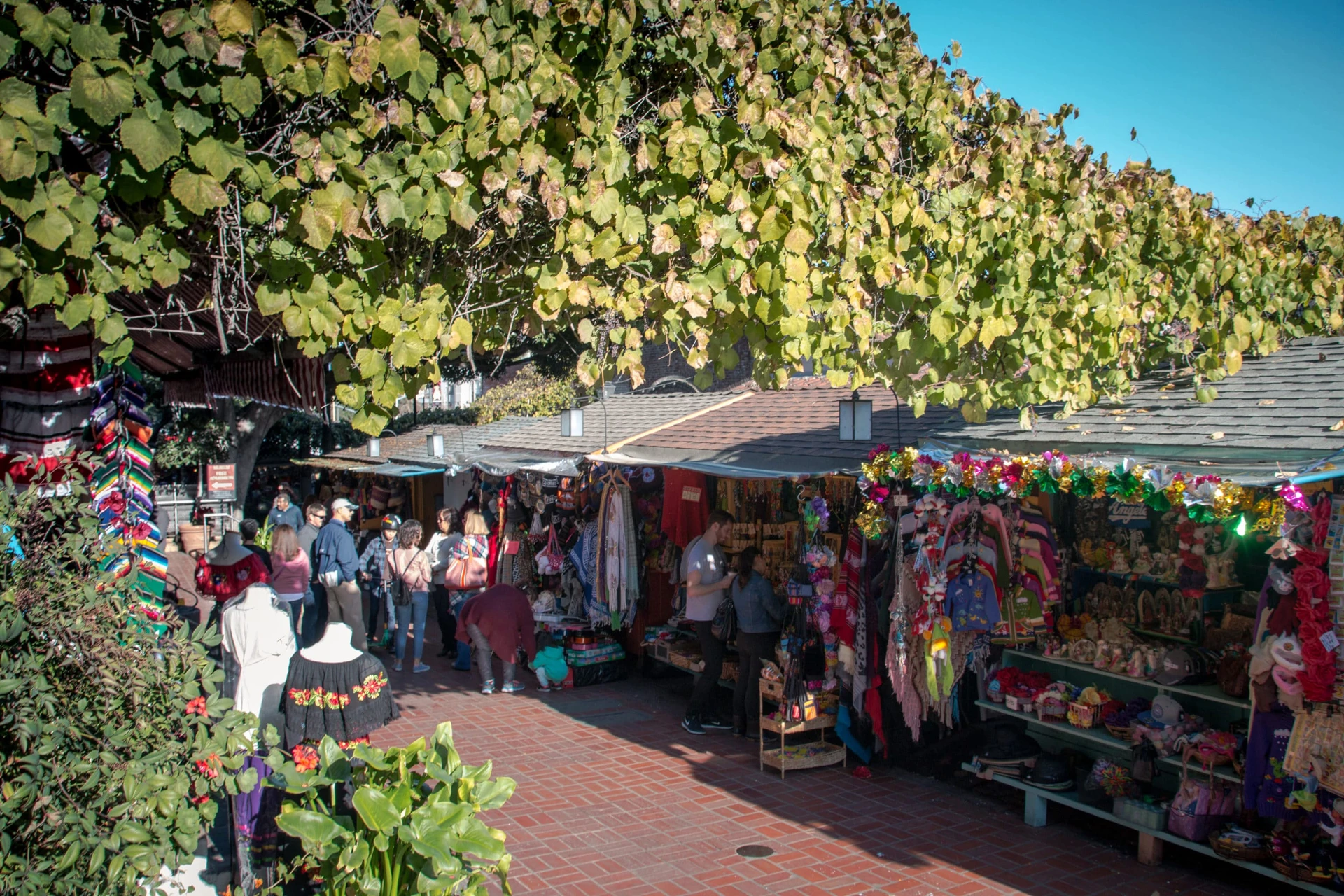 People shopping the stalls at Olvera Street in Los Angeles.