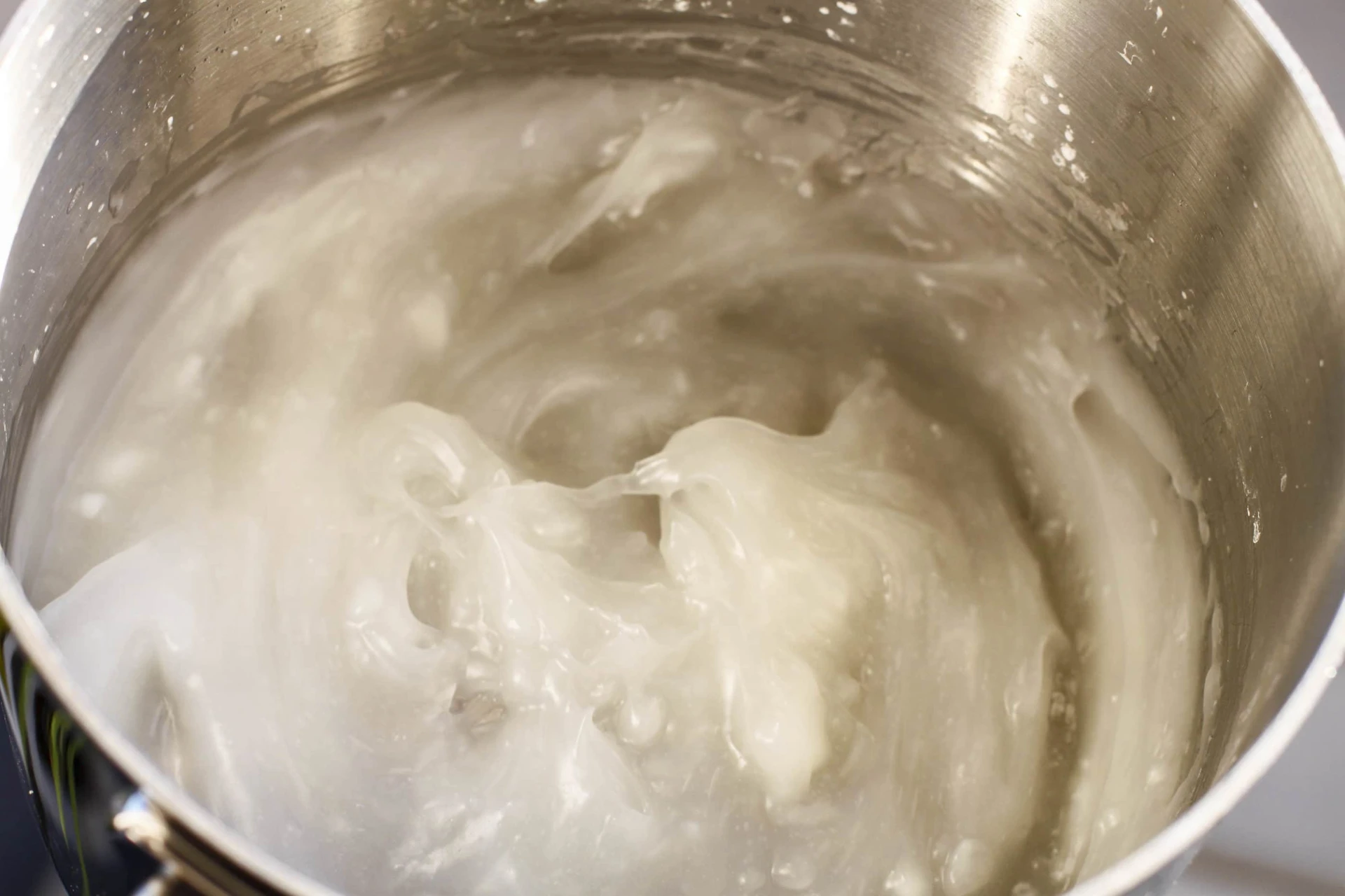 Cornstarch recipe thickening in a pan before food coloring is applied.