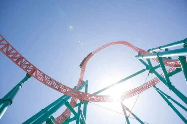 A car about to go down a very steep drop on the track of Xcelerator roller coaster at Knott's Berry Farm.