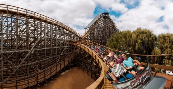 Guests hurl down the wooden track on Ghost Rider at Knott's Berry Farm.